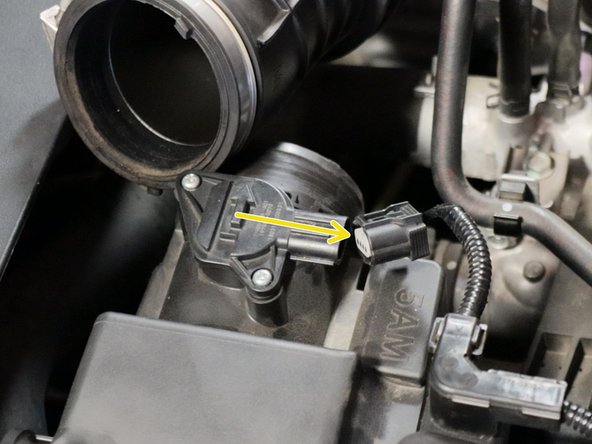 Loosen the intake tube clamp, slide it off of the airbox and then unplug the MAF sensor.