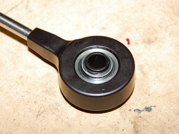 Slide it through the bushing and snap on the retaining ring as illustrated(Fig 2).