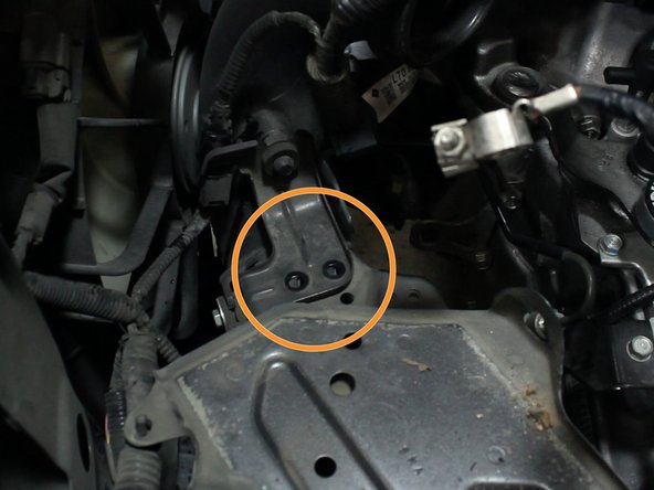 Remove the bolts that hold the battery tray to the wire harness bracket.