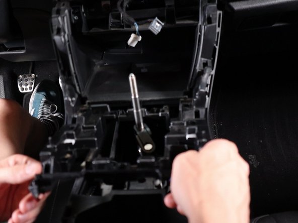 Then pull the upper section upwards and remove it from the car.