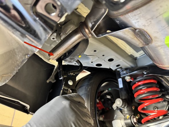 Remvove the exhaust from the rubber hangers. You can use a little spray lubricant and/or a removal tool to make the job easier.