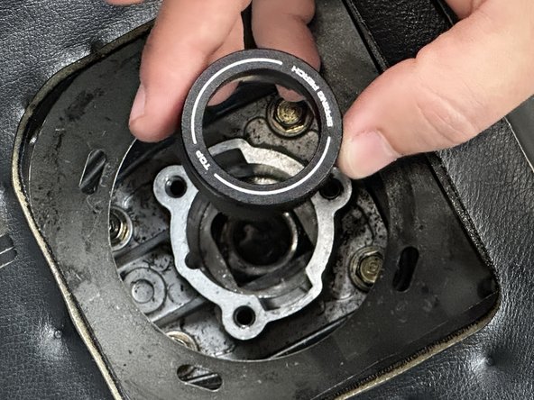 Locate the Spring Perch (#6) and install it into the transmission.