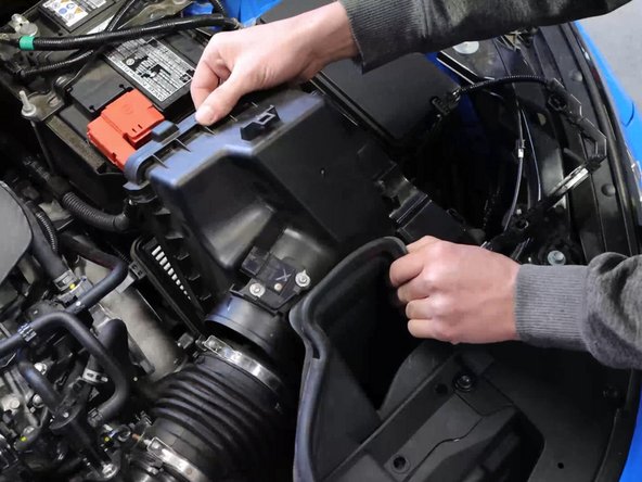 Unclip the airbox lid and remove it from the engine bay.