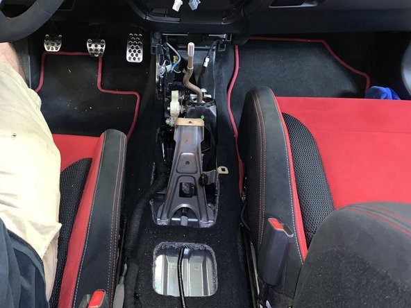 Lift the rear section up and remove the entire console from the car.