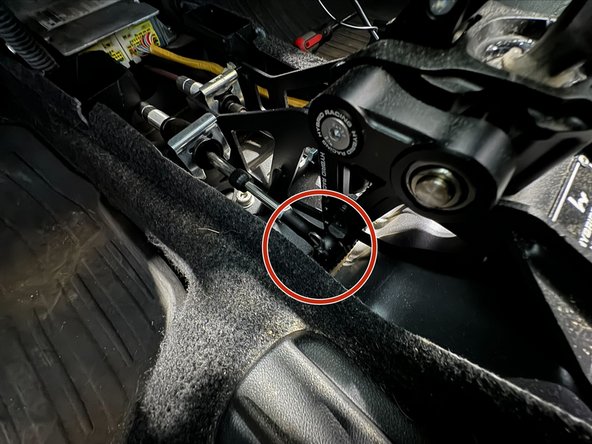 Remove the shifter cable clips. Use same technique as removal from the Transmission.