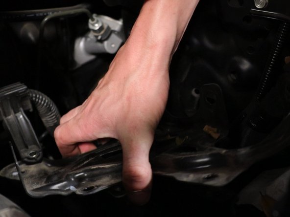 Unbolt the battery tray and remove it from the car.