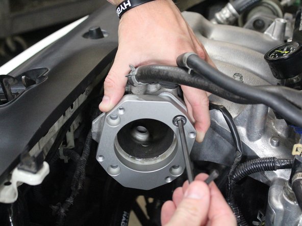 Use the shorter supplied bolts to mount the adapter to the intake manifold.