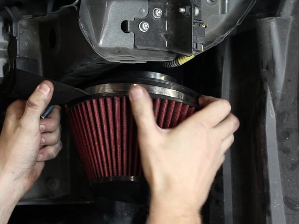 Install the filter bracket before tightening the clamps.