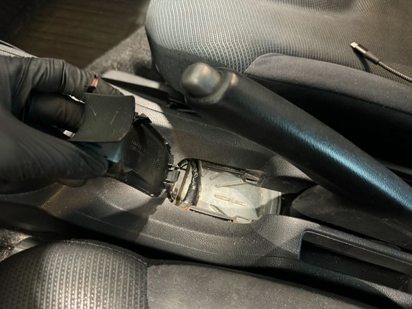 Remove this panel will console to slip over the handbrake