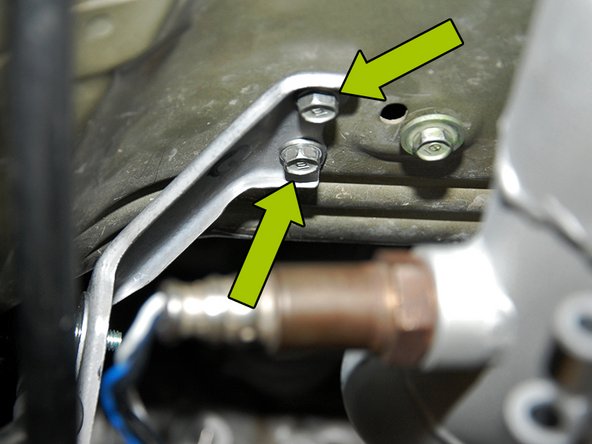 Once you have removed the heat shield, you will need to remove the (2) mounting brackets and the mounting plate using a 10mm socket.