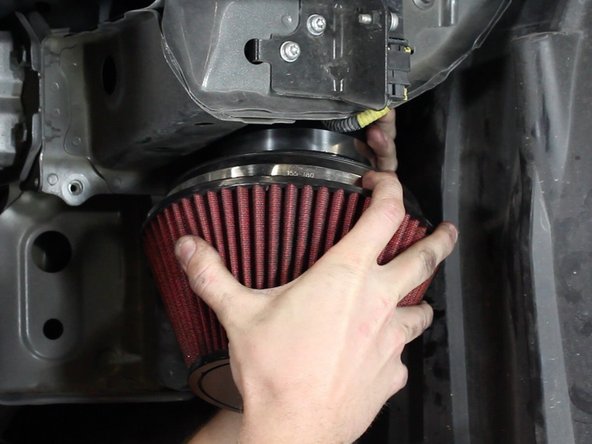 Install the filter bracket before tightening the clamps.