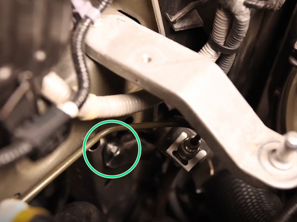 Unbolt the clutch line brackets.