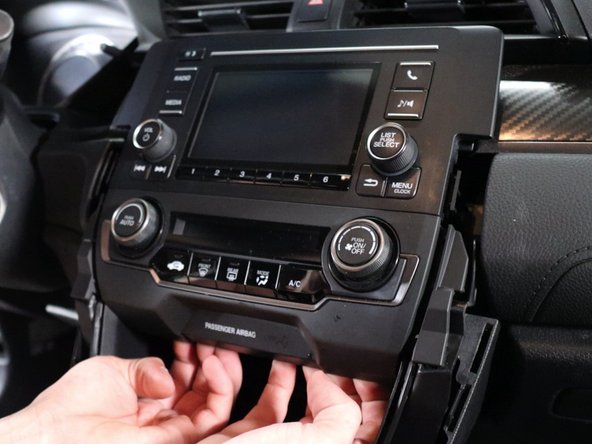 Use your fingers and gently pry the HVAC control panel outward. This will unclip and then you can unplug it.