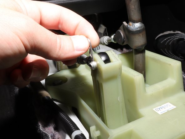 Remove the LH side shifter cable from the shifter.