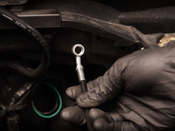 Route the clutch line between the engine mount and frame rail.