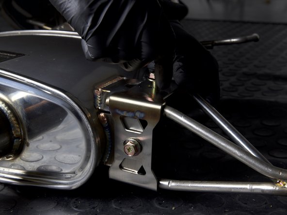 Locate and install the rear muffler brackets with the supplied hardware. Thread both sides together and be sure to keep them loose so the system can be adjusted once on the car.