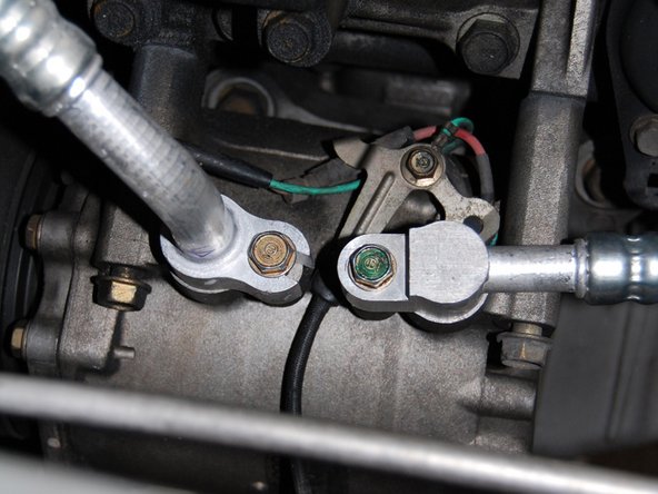 Once the condenser is mounted, install line D which goes from the top of the condenser to the compressor.