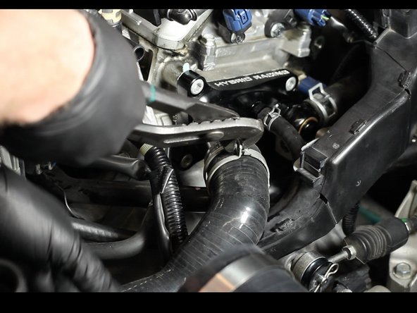 Re-install the upper coolant hose.