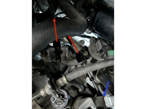 Push the cables (in direction of arrows) into the exhuast tunnel to disconnect them from the bracket.