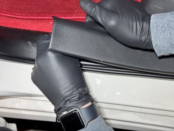 Once the harness slides under the rear sill panel, pull it through and run it along the driver side.