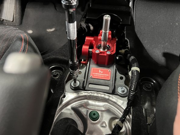 Use the supplied hardware and bolt the shifter base to the chassis.