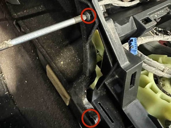 On the driver side remove the two screws that hold the inner pocket to the console.