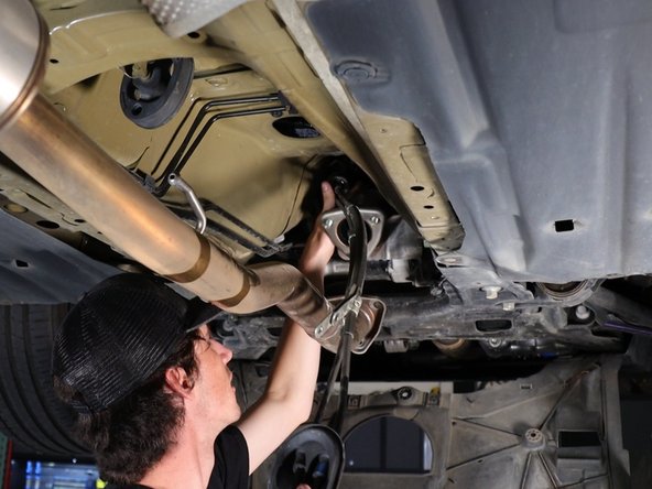 Pull downward on the shifter cable seal and this will remove the cables from the chassis.