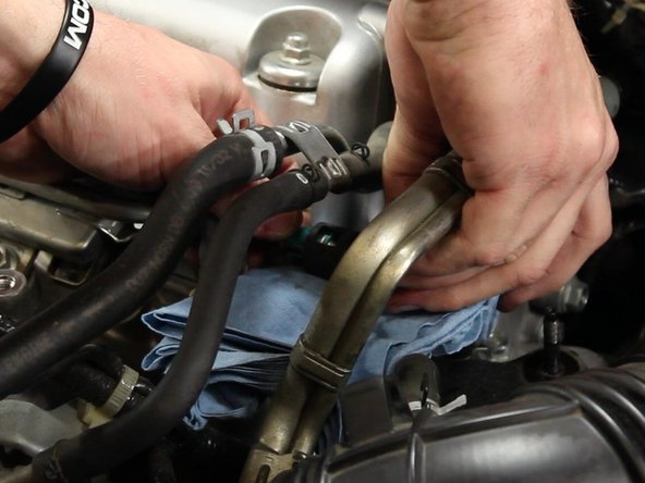 Once the line has been disconnected, turn the fitting upward to prevent more fuel from spilling.