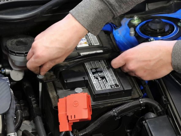 Remove the battery tie-down bracket.