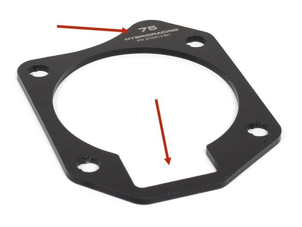 Install the throttle body gasket with the etching facing OUTWARD. The IACV provision should also locate at the bottom section of the manifold flange. Failure to align these parts can result in leaks.