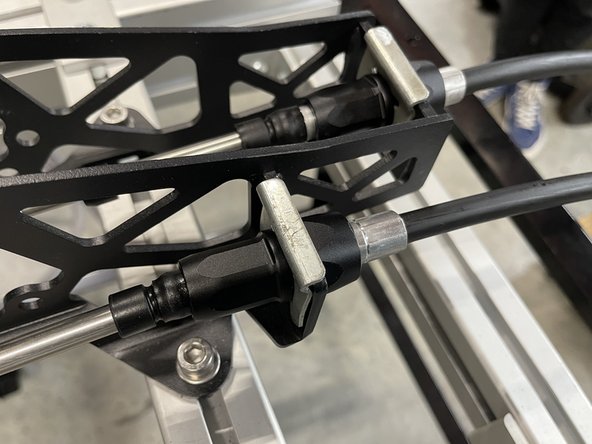 Now install the other cable in the same way as the previous cable. Use the supplied clip and attach it to the shifter arm.