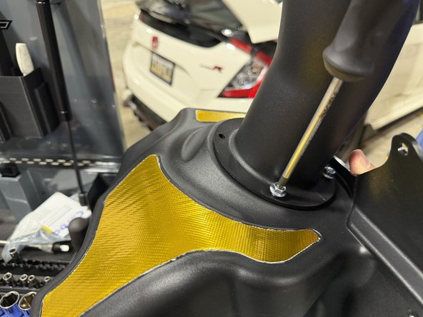Fasten the tube to the box with the supplied screws. Get all the screws started loose before you snug any of them down. No thread locker needed.