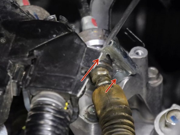 Use a flat tipped screw driver and remove the shifter cable spring clips.