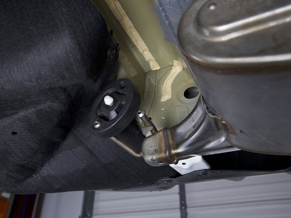 Remvove the exhaust from the rubber hangers. You can use a little spray lubricant and/or a removal tool to make the job easier.