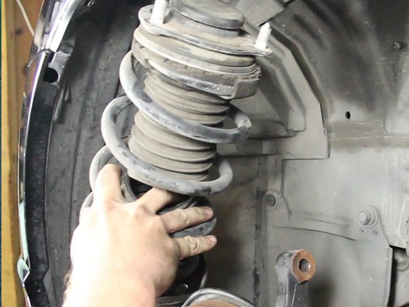 Remove the strut from the car.