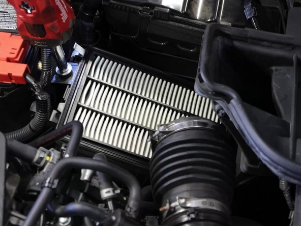 Remove the air filter from the lower tray.