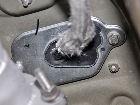 Next we need to move back under the car to install the mounting plate back to the bottom of the car.