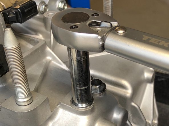 Once you have changed all three springs, thread the bolts back in by hand.