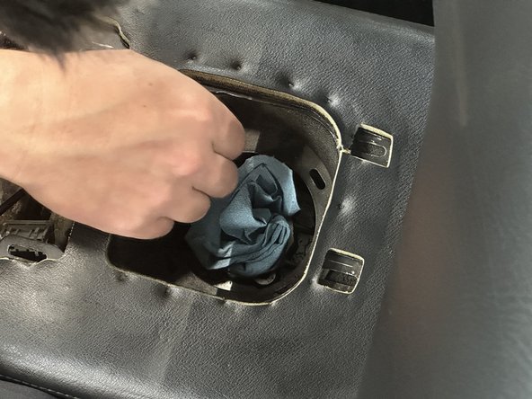 Take a clean rag or shop towel and cover the opening of the transmission. Be sure to prevent any dirt or debris from falling in.