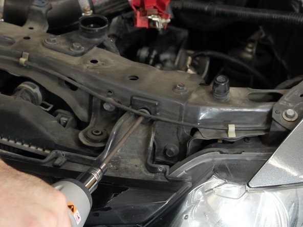 The sides of the bumper snap in place. Once both screws are removed, you'll need to pop the bumper out of the brackets.