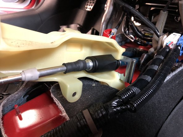 Slide the shifter cable into the shifter base and secure it using the supplied shifter cable C clip.
