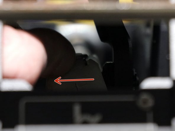 While holding it apart, pull the end link off the pivot ball.