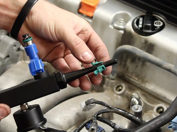 Install  the quick disconnect fuel line connection clip.