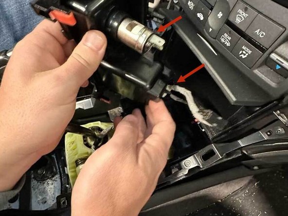 Pull the coin tray mount out just enough to remove the connectors from the mount, then entirely remove the mount.