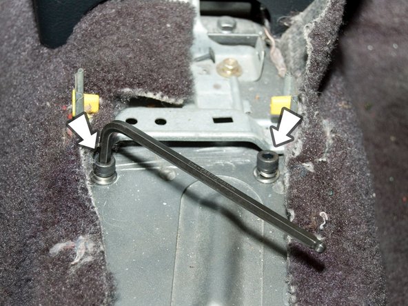 From inside the cabin, install the two M8 bolts that thread into the front mounting holes for the shifter.