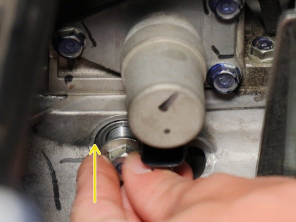 Reinstall both springs into the transmission.