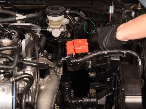 Remove the battery bracket from the car.