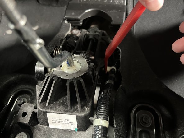 Remove the factory wiring harness from the stock shifter assembly.