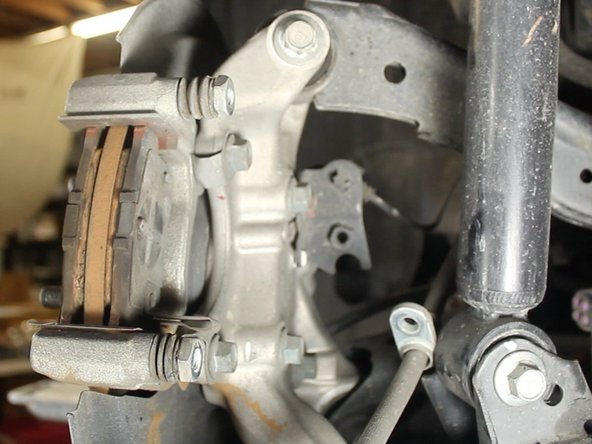 If the emergency brake is engaged, you will not be able to remove the piston housing from the caliper. Disengage for removal.