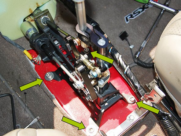 Using the (4) M8 bolts, (4) flat washers, and a 6mm allen key, mount the shifter to the center tunnel.